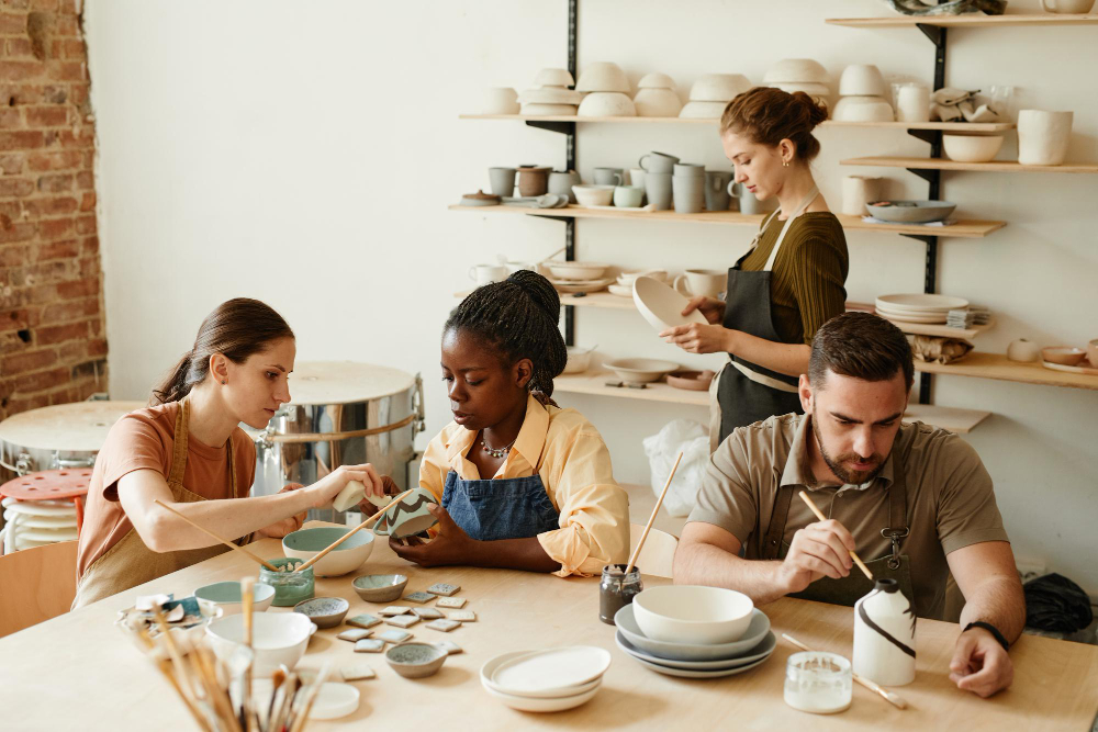 painting and organizing handmade ceramic pottery