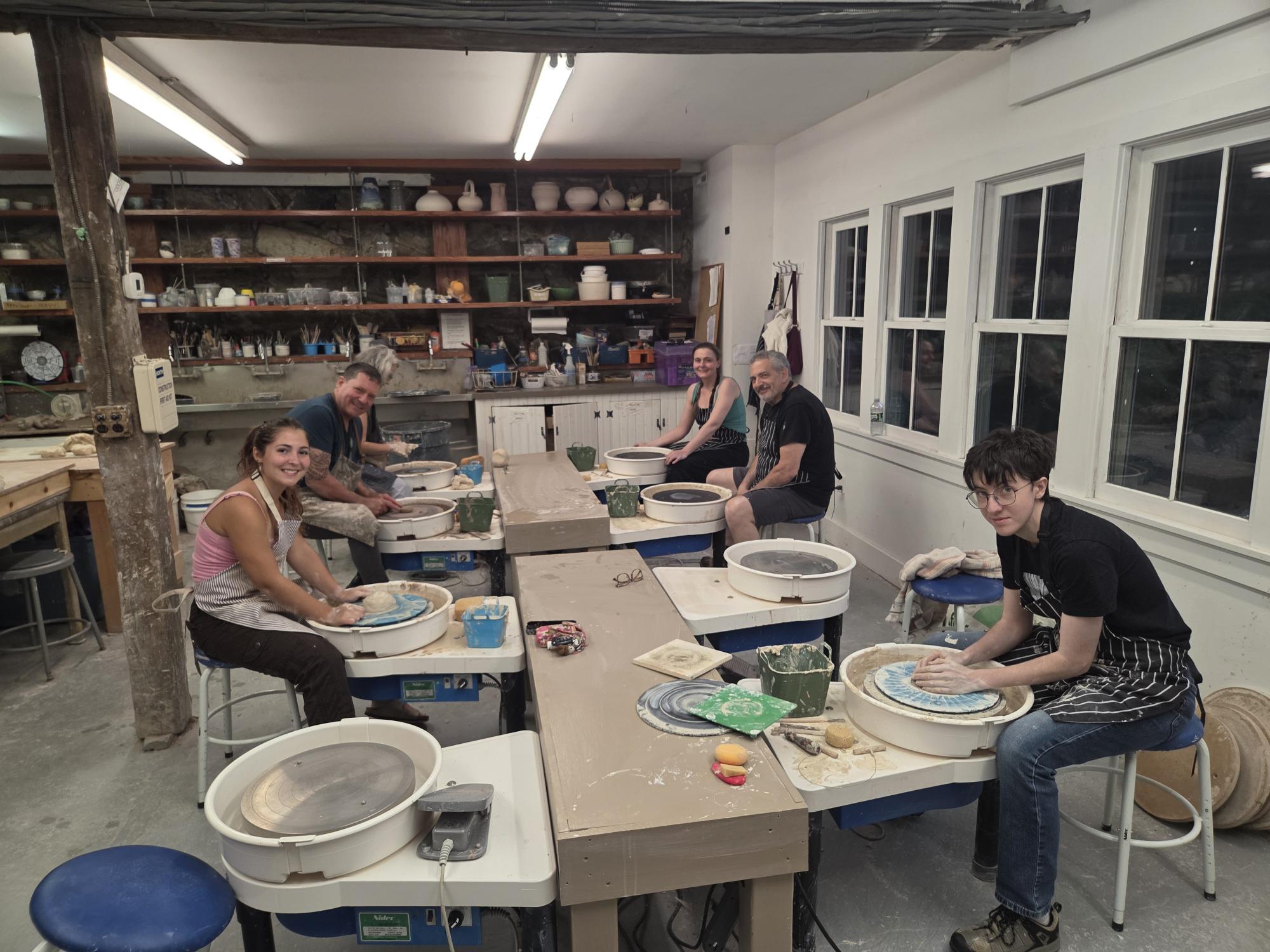 students working with clay
