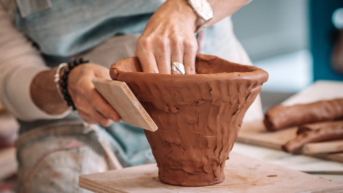 hand-building a clay pot