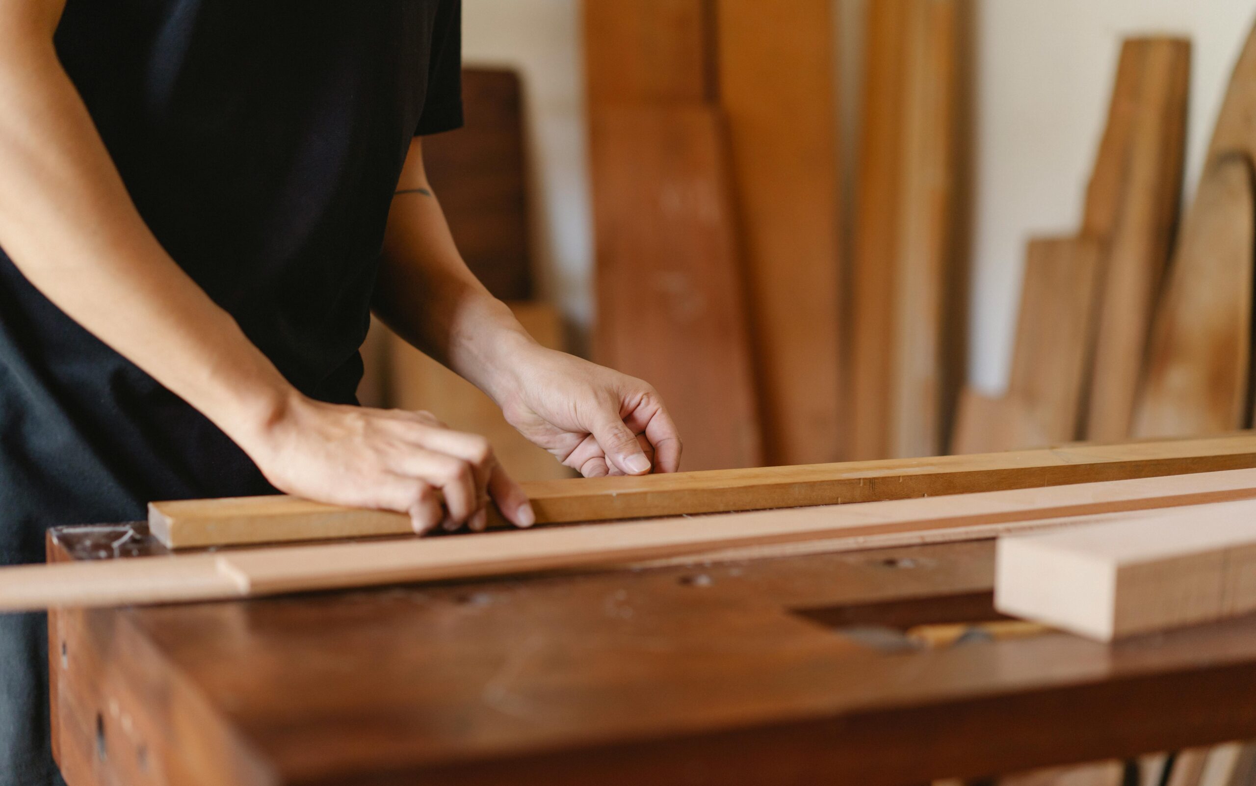 a student working with wood at the Brookfield Craft Center