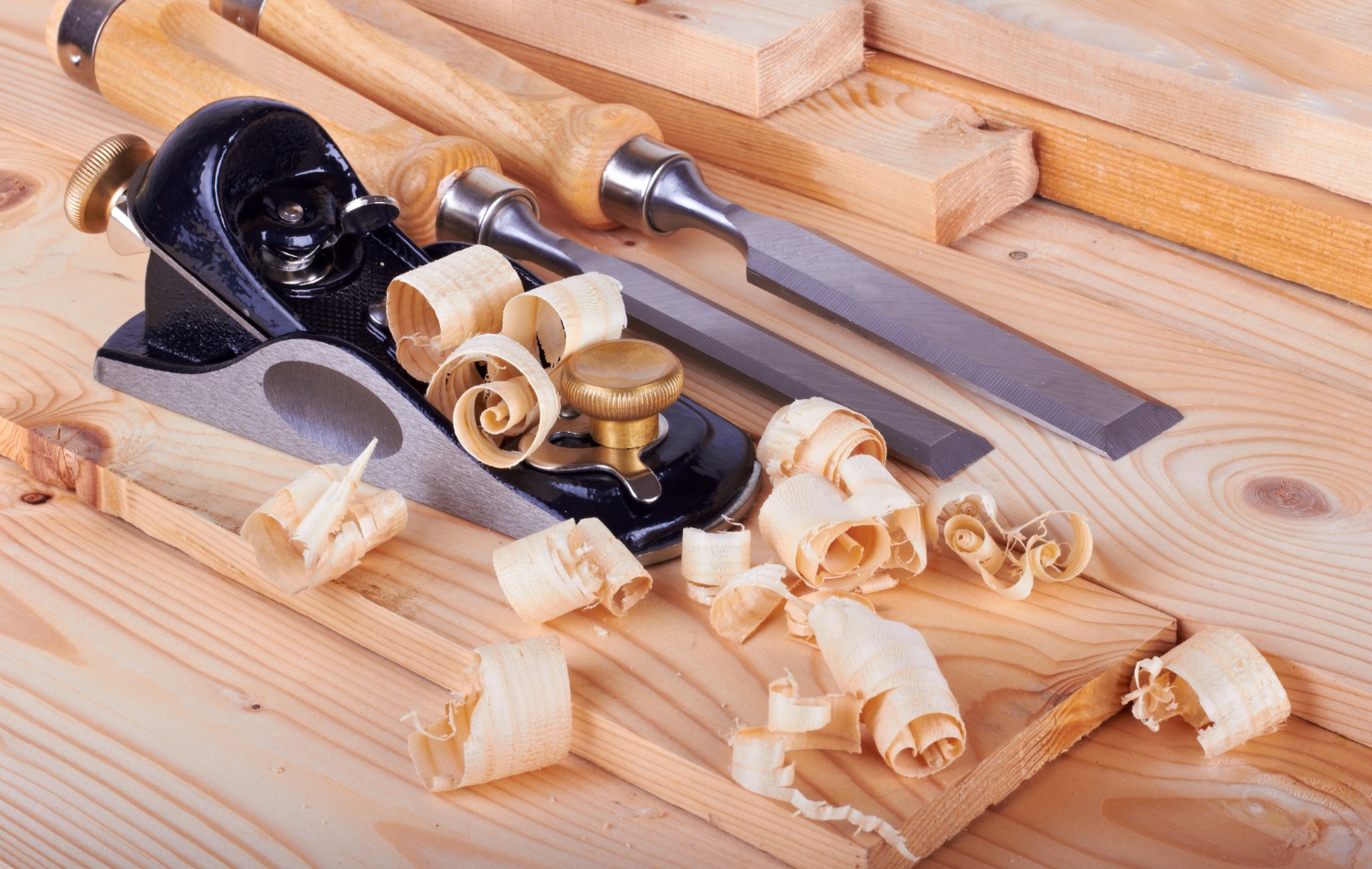 black metal block plane with brass adjustment knobs