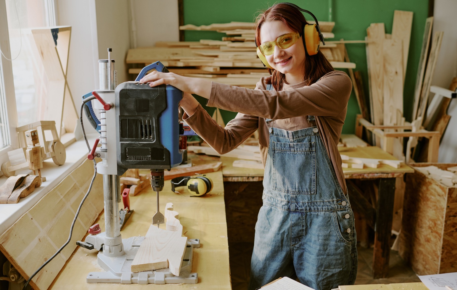 young woodworker wearing safety glasses